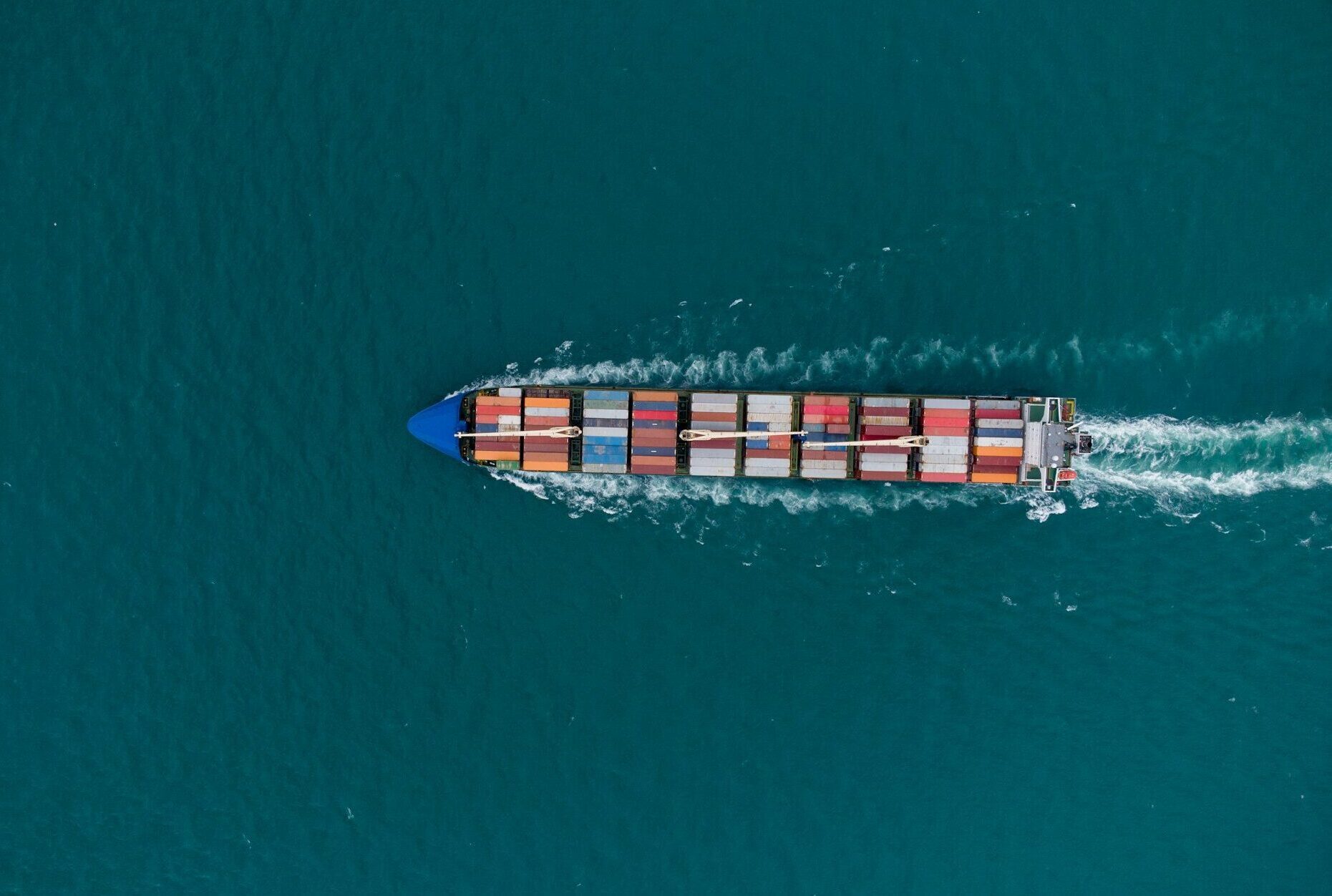 Aerial view of cargo container ship in the sea